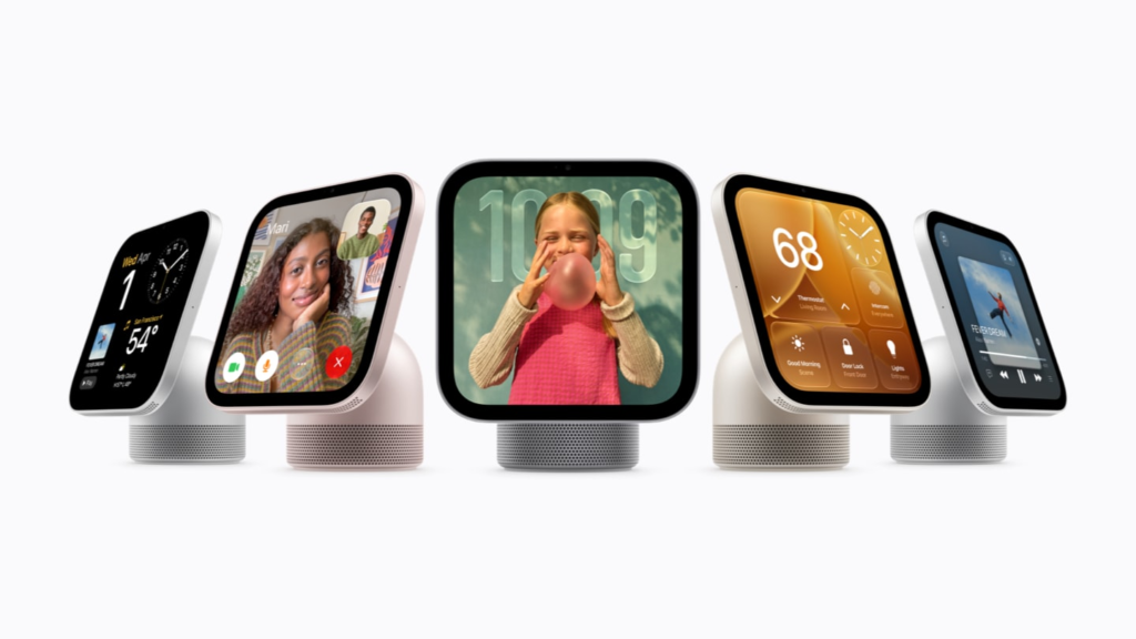 Group of smart speakers with colorful square screens showing apps and faces, in a row on a white background.